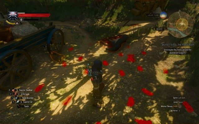 Investigate the tracks around the abandoned wagons.