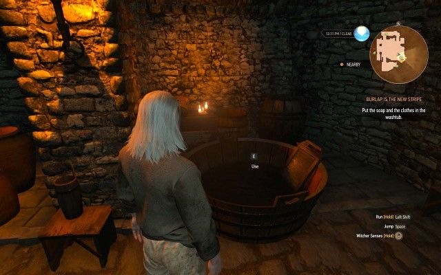 Put the soap and the clothes in the washtub.
